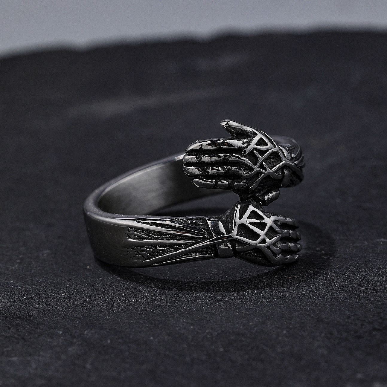 Cool style retro hands embracing design ring