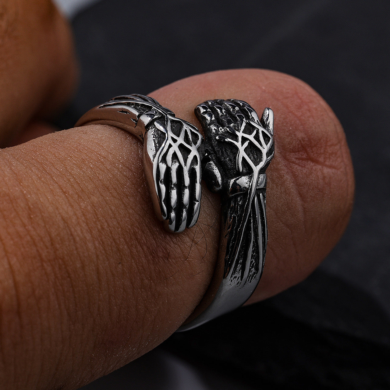 Cool style retro hands embracing design ring