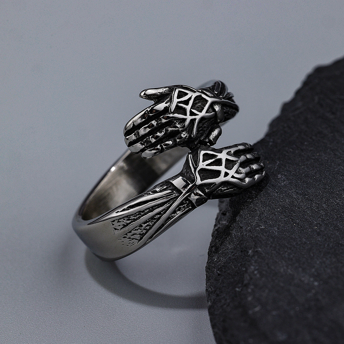 Cool style retro hands embracing design ring